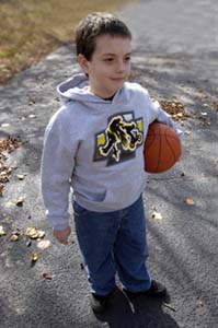 boy with basketball wearing screen printed shirt