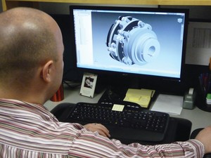 Man sitting in front of Wind Turbine Computer Design on screen